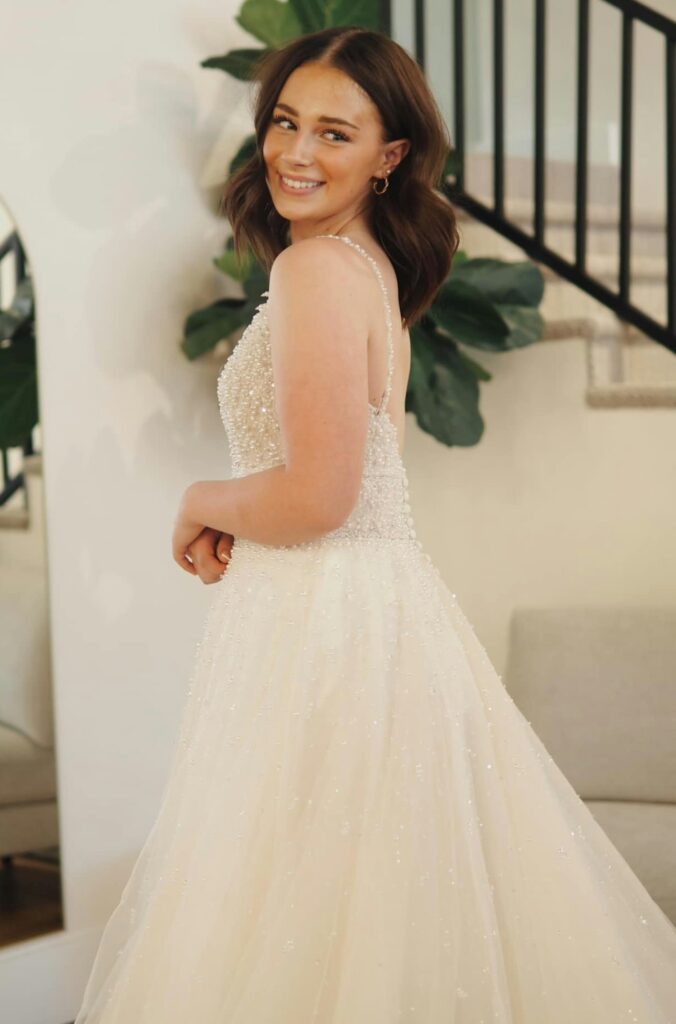 Girl looking over her shoulder in a wedding dress