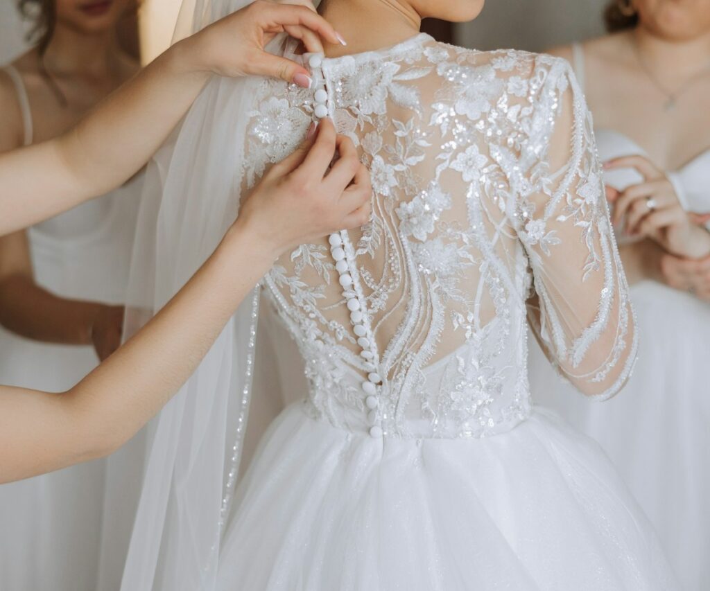 woman trying on a wedding dress