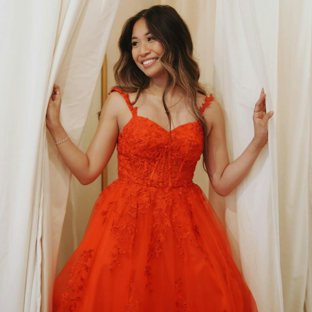 girl in a fluffy red prom dress